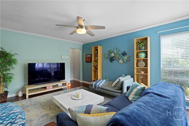 505 Pointe N Dr, Savannah, GA 31410 - living room featuring ceiling fan, a textured ceiling, wood finished floors, and ornamental molding