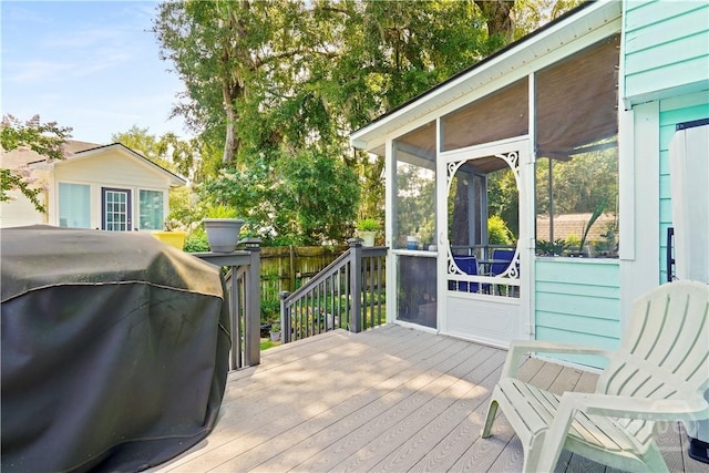 505 Pointe N Dr, Savannah, GA 31410 - wooden deck with area for grilling and a sunroom