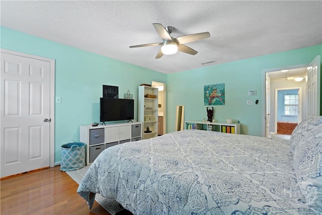 505 Pointe N Dr, Savannah, GA 31410 - bedroom with wood finished floors, a textured ceiling, and ceiling fan