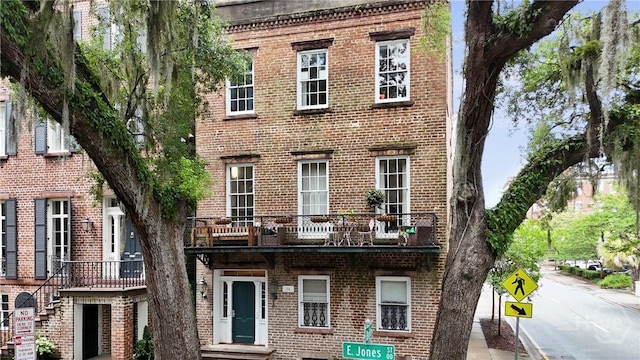 24 E Jones St, Savannah, GA 31401 - view of front of home featuring brick siding