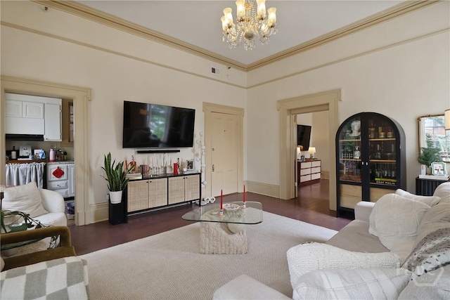 24 E Jones St, Savannah, GA 31401 - living area featuring a chandelier, wood finished floors, and ornamental molding