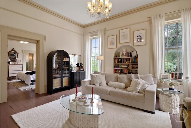 24 E Jones St, Savannah, GA 31401 - living room featuring a chandelier, plenty of natural light, hardwood / wood-style floors, and crown molding