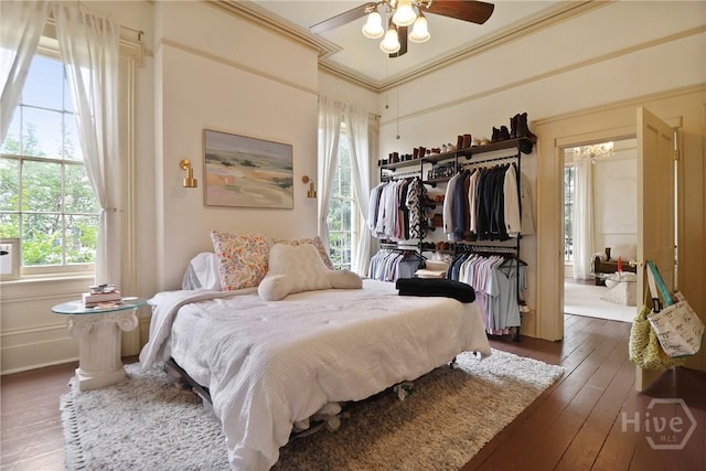 24 E Jones St, Savannah, GA 31401 - bedroom with ornamental molding, wood-type flooring, and ceiling fan