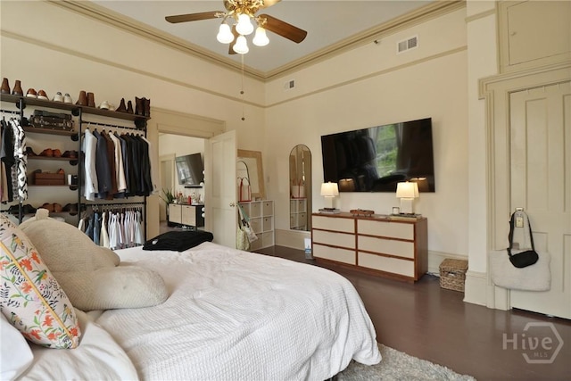 24 E Jones St, Savannah, GA 31401 - bedroom featuring arched walkways, a closet, wood finished floors, ornamental molding, and a towering ceiling