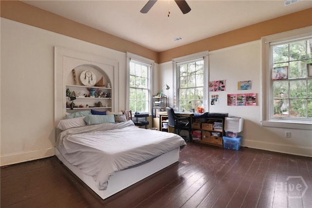 24 E Jones St, Savannah, GA 31401 - bedroom with dark wood-style floors and ceiling fan
