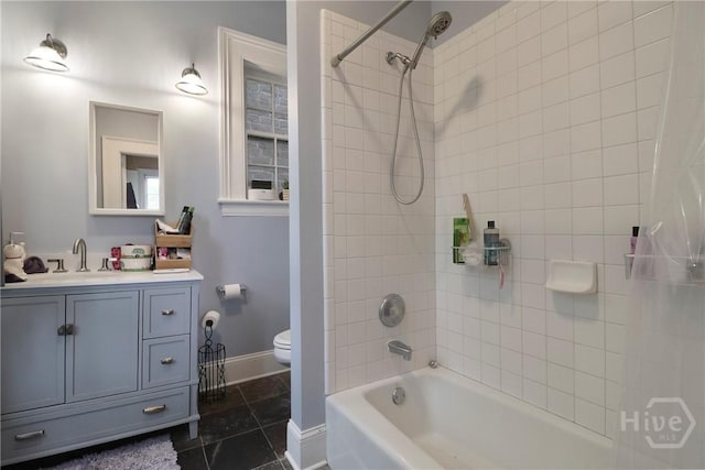 24 E Jones St, Savannah, GA 31401 - bathroom featuring vanity, shower / bathtub combination, and tile patterned flooring