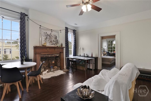 24 E Jones St, Savannah, GA 31401 - living area featuring a fireplace, wood-type flooring, and a ceiling fan