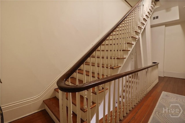 24 E Jones St, Savannah, GA 31401 - stairs featuring wood finished floors and baseboards