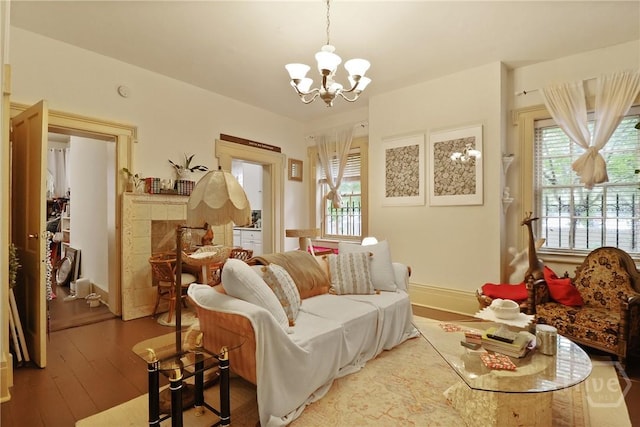 24 E Jones St, Savannah, GA 31401 - living room featuring a chandelier, healthy amount of natural light, and hardwood / wood-style flooring