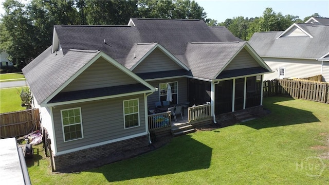 97 Misty Dr, Richmond Hill, GA 31324 - back of house featuring a fenced backyard, a sunroom, and roof with shingles