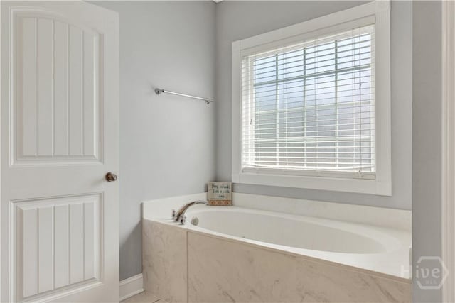97 Misty Dr, Richmond Hill, GA 31324 - bathroom featuring healthy amount of natural light and a bath