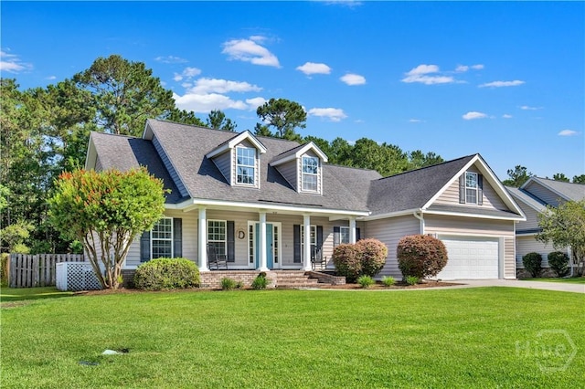 97 Misty Dr, Richmond Hill, GA 31324 - new england style home featuring a porch, concrete driveway, roof with shingles, and a garage