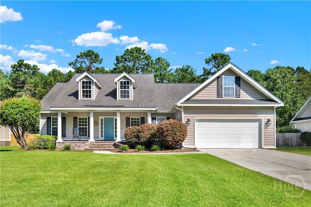 97 Misty Dr, Richmond Hill, GA 31324 - view of front of house featuring covered porch, concrete driveway, roof with shingles, and a garage