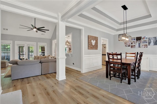 97 Misty Dr, Richmond Hill, GA 31324 - dining space featuring wood finished floors, crown molding, a ceiling fan, a chandelier, and vaulted ceiling