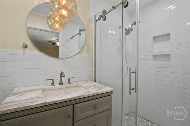 206 Devonshire Rd, Savannah, GA 31410 - bathroom featuring vanity, a stall shower, tile walls, and ceiling fan