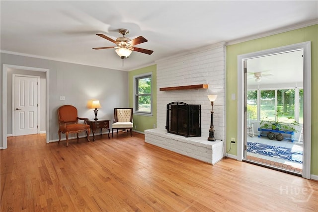 206 Devonshire Rd, Savannah, GA 31410 - living area featuring ceiling fan, ornamental molding, a brick fireplace, and wood finished floors