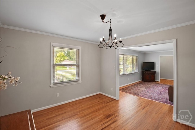 206 Devonshire Rd, Savannah, GA 31410 - unfurnished room featuring a chandelier, light wood-style floors, and ornamental molding