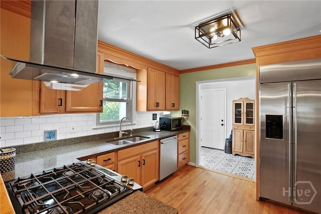 206 Devonshire Rd, Savannah, GA 31410 - kitchen featuring appliances with stainless steel finishes, wall chimney exhaust hood, backsplash, ornamental molding, and light wood-style floors