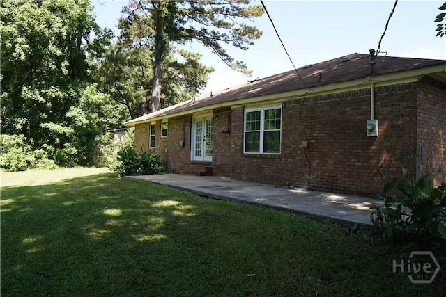 803 Jamestowne Rd, Savannah, GA 31419 - back of property featuring a yard, a patio area, brick siding, and french doors