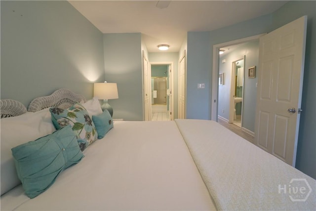 1615 Strand Ave Unit 4, Tybee Island, GA 31328 - bedroom featuring connected bathroom and baseboards