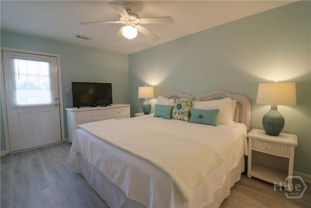 1615 Strand Ave Unit 4, Tybee Island, GA 31328 - bedroom with wood finished floors and ceiling fan