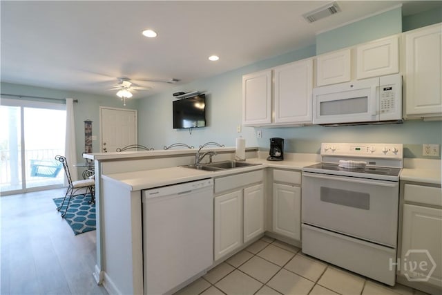 1615 Strand Ave Unit 4, Tybee Island, GA 31328 - kitchen with white appliances, a peninsula, a ceiling fan, white cabinets, and recessed lighting