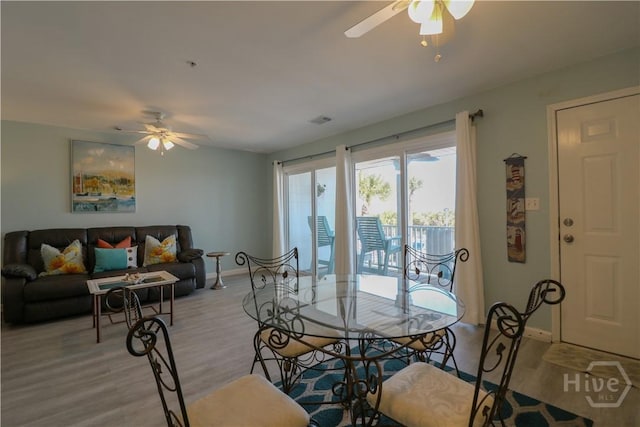 1615 Strand Ave Unit 4, Tybee Island, GA 31328 - dining room with a ceiling fan and light wood finished floors