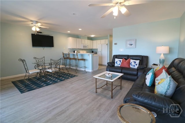1615 Strand Ave Unit 4, Tybee Island, GA 31328 - living room featuring ceiling fan, light wood-style floors, and recessed lighting