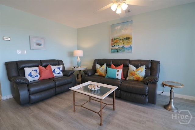 1615 Strand Ave Unit 4, Tybee Island, GA 31328 - living room featuring ceiling fan and light wood-style floors