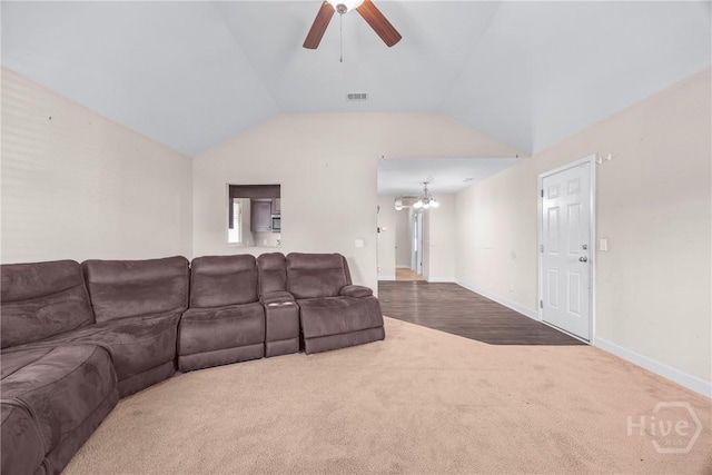 57 Fiore Dr, Savannah, GA 31419 - living area featuring carpet flooring, ceiling fan, vaulted ceiling, and a chandelier