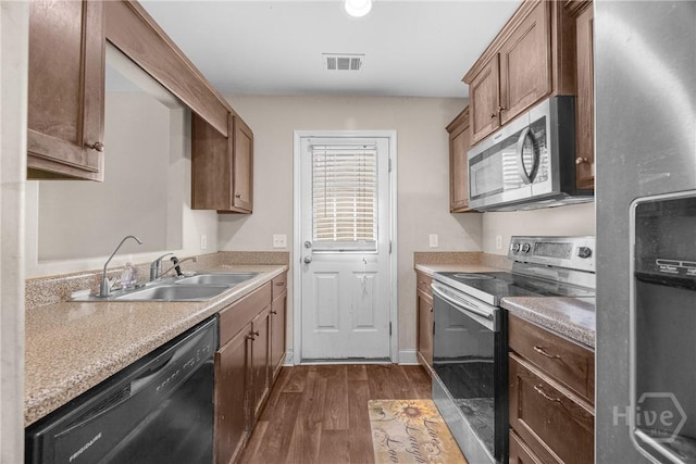 57 Fiore Dr, Savannah, GA 31419 - kitchen with appliances with stainless steel finishes, dark wood finished floors, and light countertops