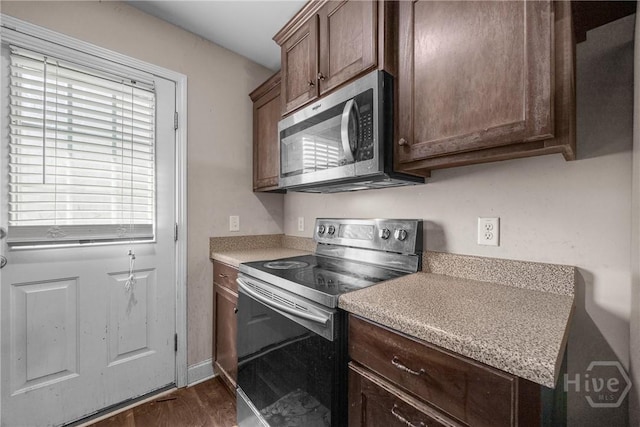 57 Fiore Dr, Savannah, GA 31419 - kitchen with appliances with stainless steel finishes, dark wood-style floors, and light countertops