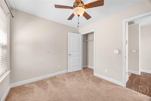 57 Fiore Dr, Savannah, GA 31419 - unfurnished bedroom featuring carpet, a closet, and a ceiling fan