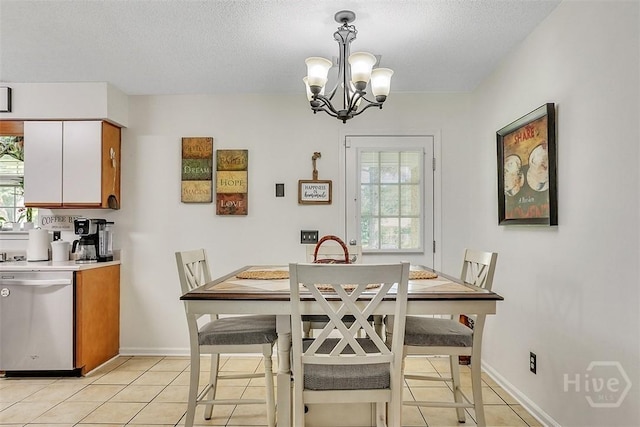 198 Jennifer Cir, Rincon, GA 31326 - dining space with light tile patterned flooring, a chandelier, and a textured ceiling