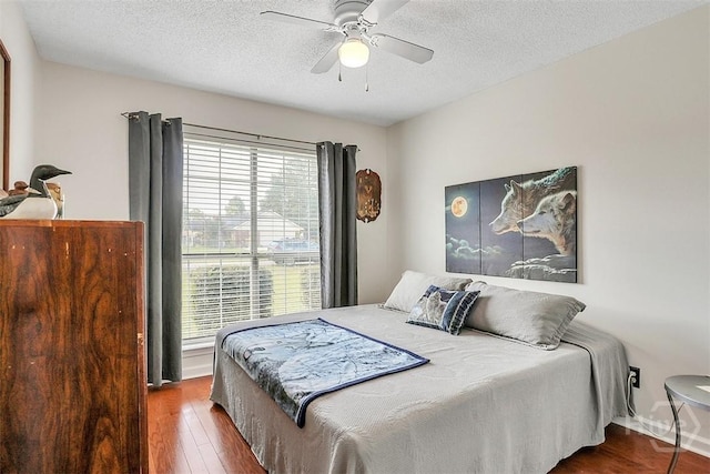 198 Jennifer Cir, Rincon, GA 31326 - bedroom featuring wood finished floors, a textured ceiling, and a ceiling fan