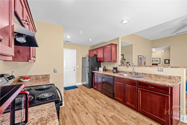 5 Winston Dr, Guyton, GA 31312 - kitchen featuring dark brown cabinets, electric range, freestanding refrigerator, black dishwasher, and a peninsula