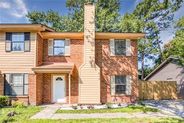 117 Fox Chase Rd, Savannah, GA 31406 - view of front of property with brick siding and a chimney