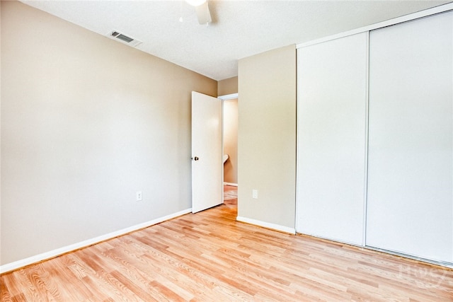 117 Fox Chase Rd, Savannah, GA 31406 - unfurnished bedroom with wood finished floors, a closet, and a ceiling fan