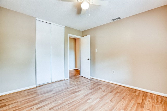 117 Fox Chase Rd, Savannah, GA 31406 - unfurnished bedroom with wood finished floors, a closet, and a ceiling fan