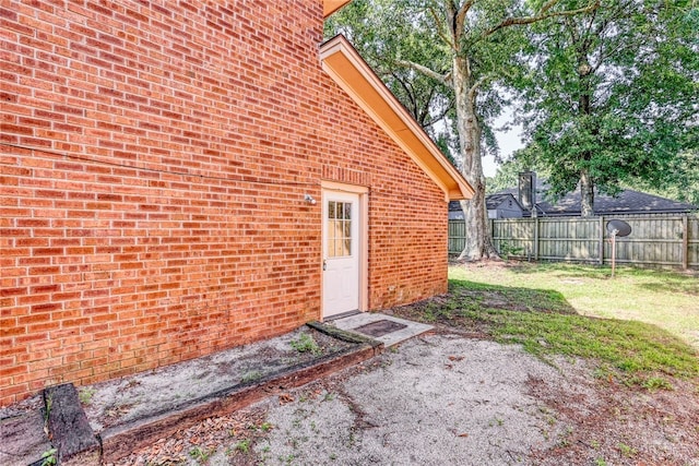117 Fox Chase Rd, Savannah, GA 31406 - doorway to property with brick siding