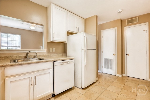 117 Fox Chase Rd, Savannah, GA 31406 - kitchen featuring white appliances, light tile patterned floors, light countertops, and white cabinets