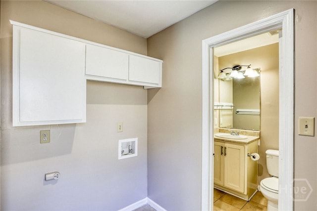 117 Fox Chase Rd, Savannah, GA 31406 - washroom featuring washer hookup and light tile patterned floors