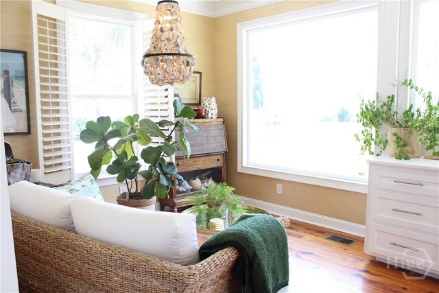 2766 Fort Mcallister Rd, Richmond Hill, GA 31324 - sitting room featuring a chandelier and light wood finished floors