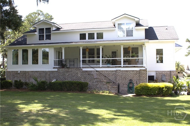 2766 Fort Mcallister Rd, Richmond Hill, GA 31324 - view of front of home featuring a front lawn and brick siding