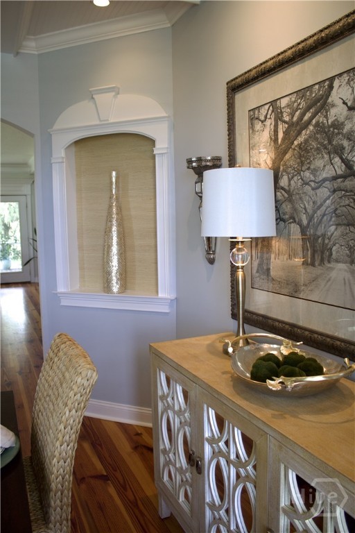 2766 Fort Mcallister Rd, Richmond Hill, GA 31324 - detailed view of wood finished floors and crown molding