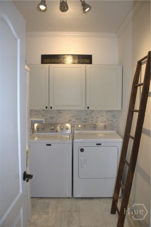 2766 Fort Mcallister Rd, Richmond Hill, GA 31324 - washroom with cabinet space, washer and clothes dryer, and ornamental molding