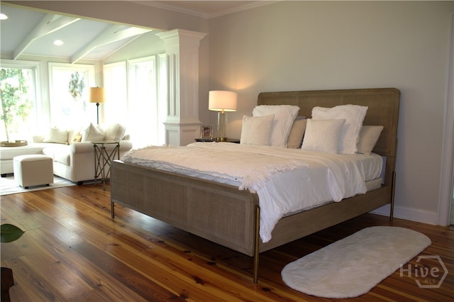 2766 Fort Mcallister Rd, Richmond Hill, GA 31324 - bedroom with decorative columns, crown molding, wood finished floors, lofted ceiling, and recessed lighting