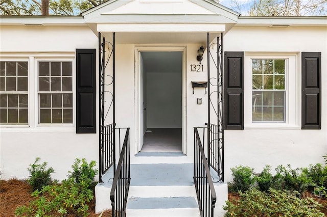 1321/1323 E 55th St, Savannah, GA 31404 - doorway to property with stucco siding