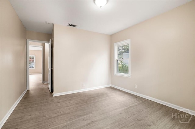 1321/1323 E 55th St, Savannah, GA 31404 - empty room featuring wood finished floors