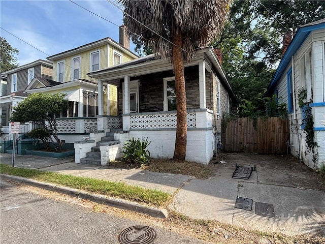 710 W 38th St, Savannah, GA 31415 - view of front of property with covered porch and stone siding